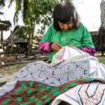 Peru Indigenous Communities woman weaving clotes in the amazon Jungle